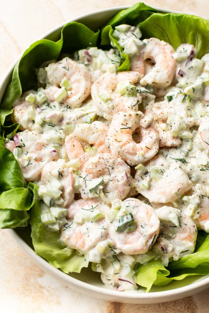 The best shrimp salad served over a bed of butter leaf lettuce (in a white salad bowl)