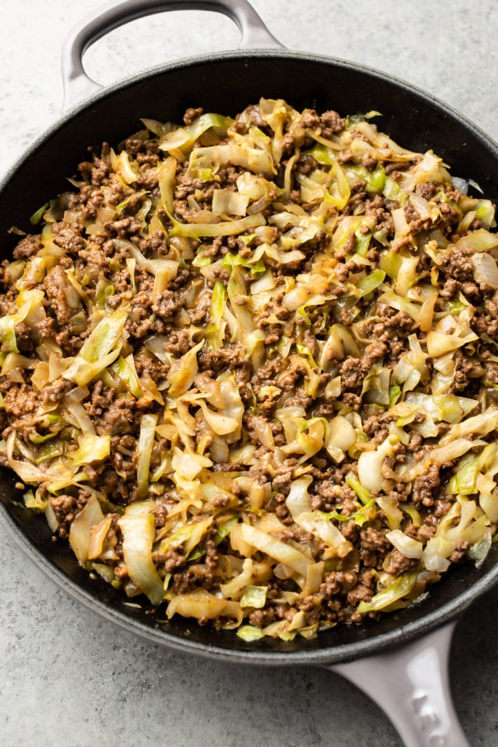 beef and cabbage stir fry in a skillet