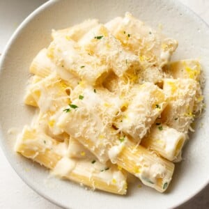 close-up of creamy lemon pasta in white bowl