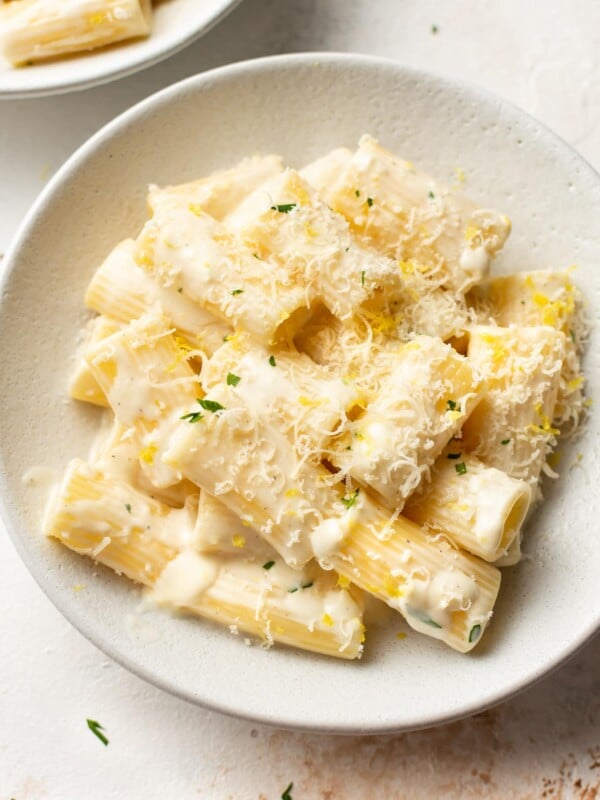 close-up of creamy lemon pasta in white bowl