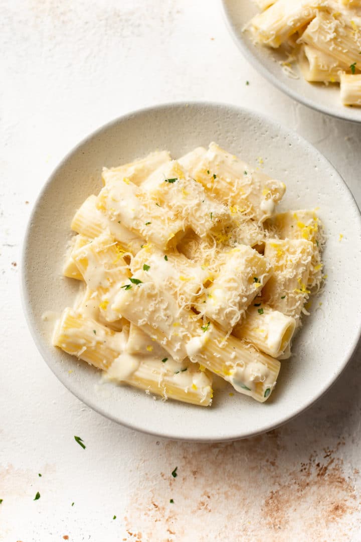 creamy lemon pasta in two white bowls