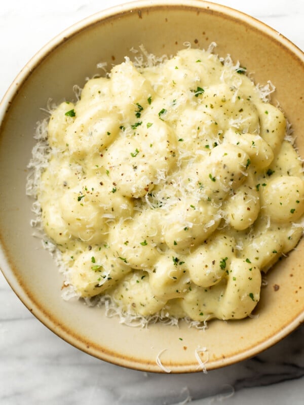 a bowl of creamy pesto gnocchi