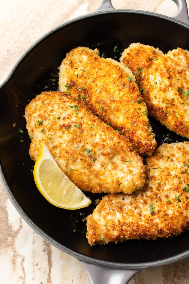 easy parmesan crusted chicken in a skillet