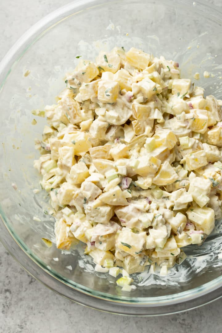 American potato salad with egg in a glass prep bowl