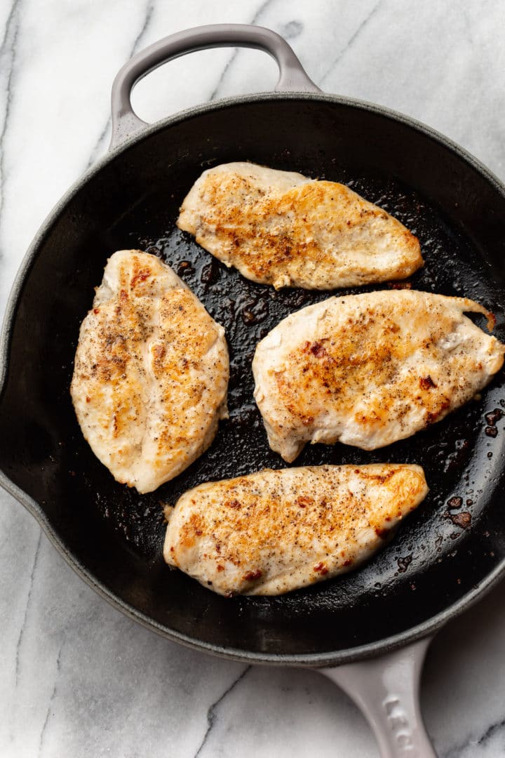 seared chicken in a skillet