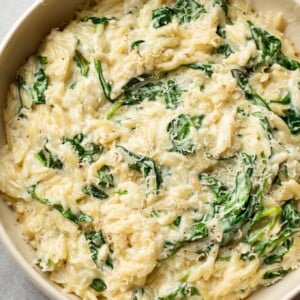 creamy orzo with spinach in a serving bowl