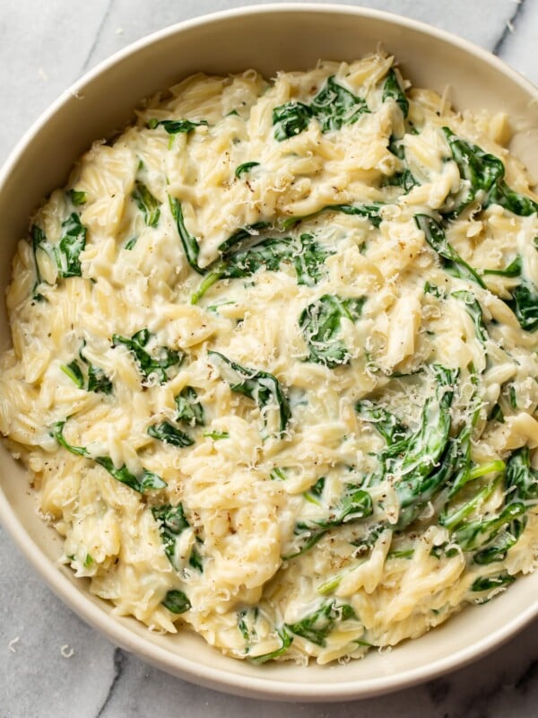 creamy orzo with spinach in a serving bowl