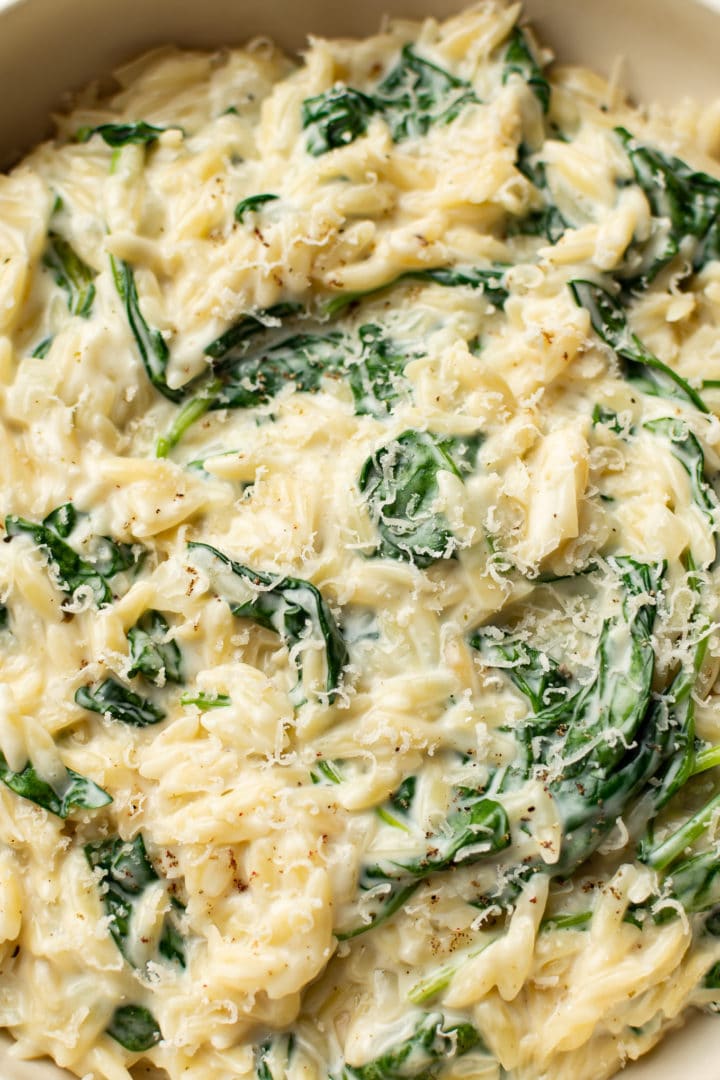 close-up of creamy garlic spinach orzo