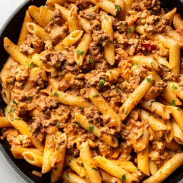 ground beef pasta in a skillet (sauce tossed with penne)
