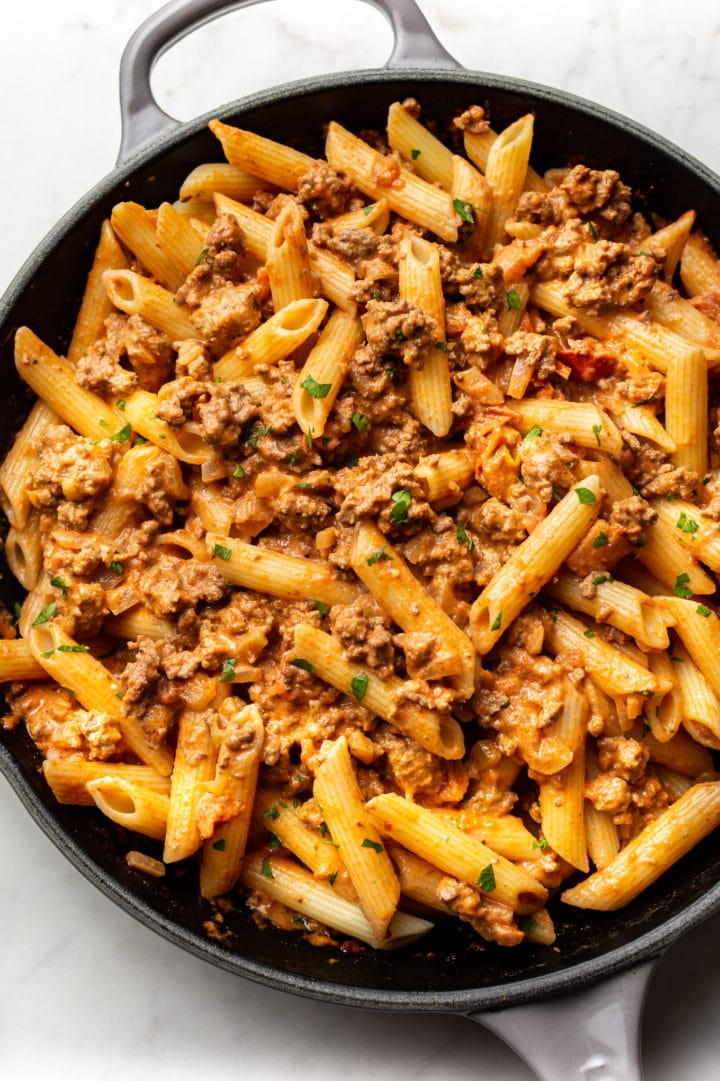 ground beef pasta in a skillet (sauce tossed with penne)