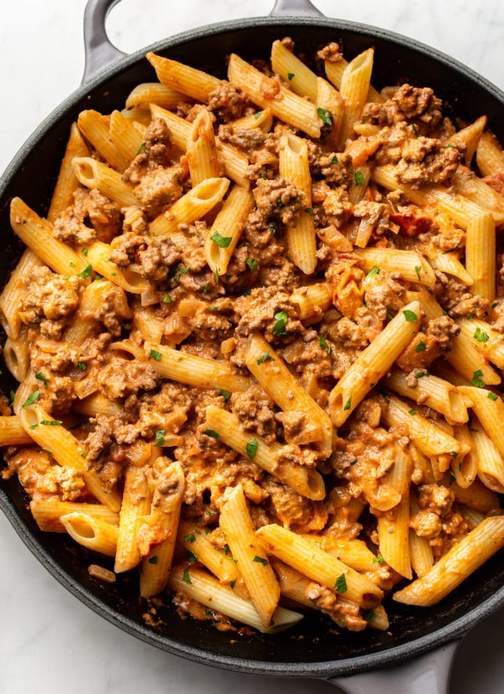 ground beef pasta in a skillet (sauce tossed with penne)