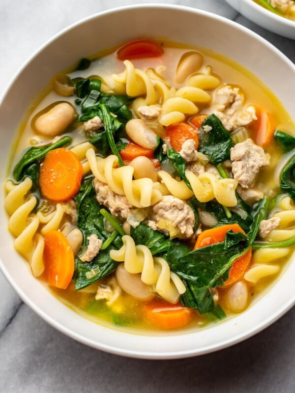 close-up of ground turkey soup in a white bowl