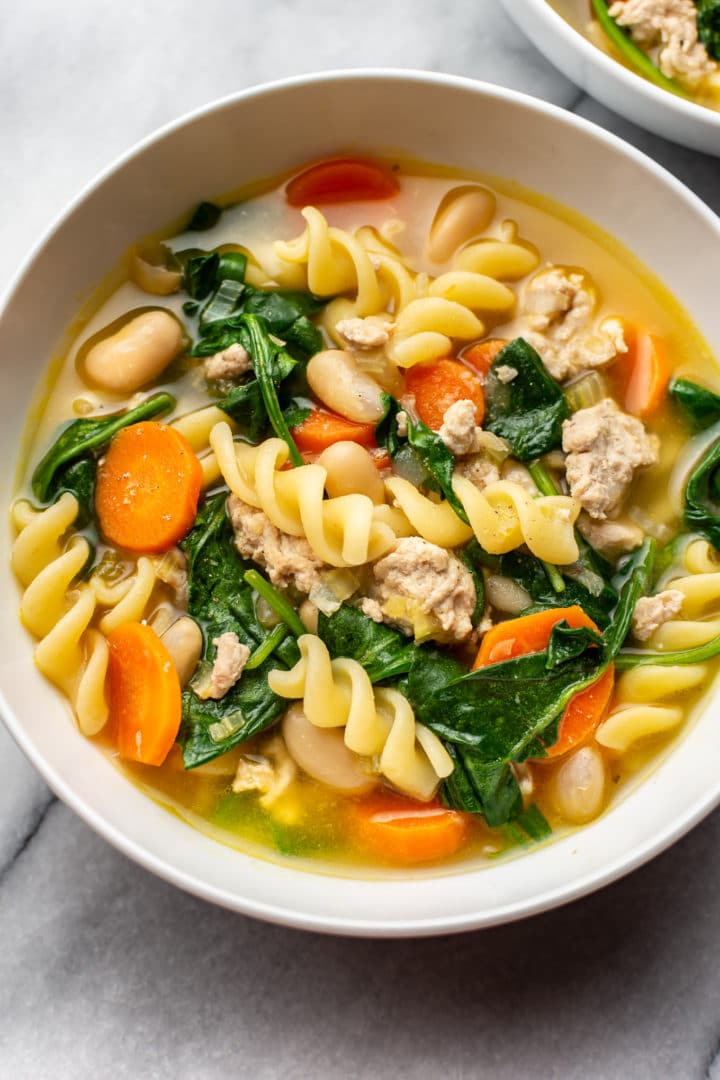 close-up of ground turkey soup in a white bowl