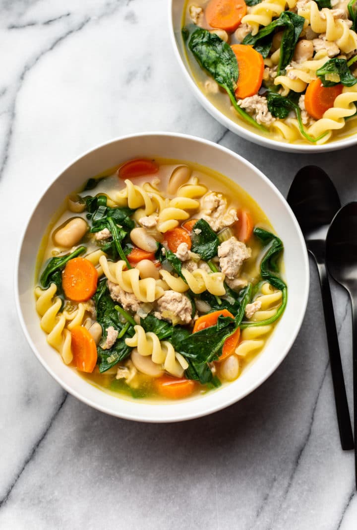 ground turkey soup in two white bowls