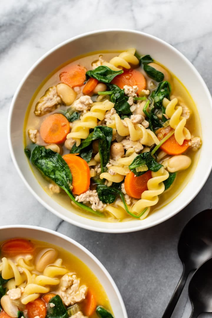 ground turkey vegetable soup in two white bowls