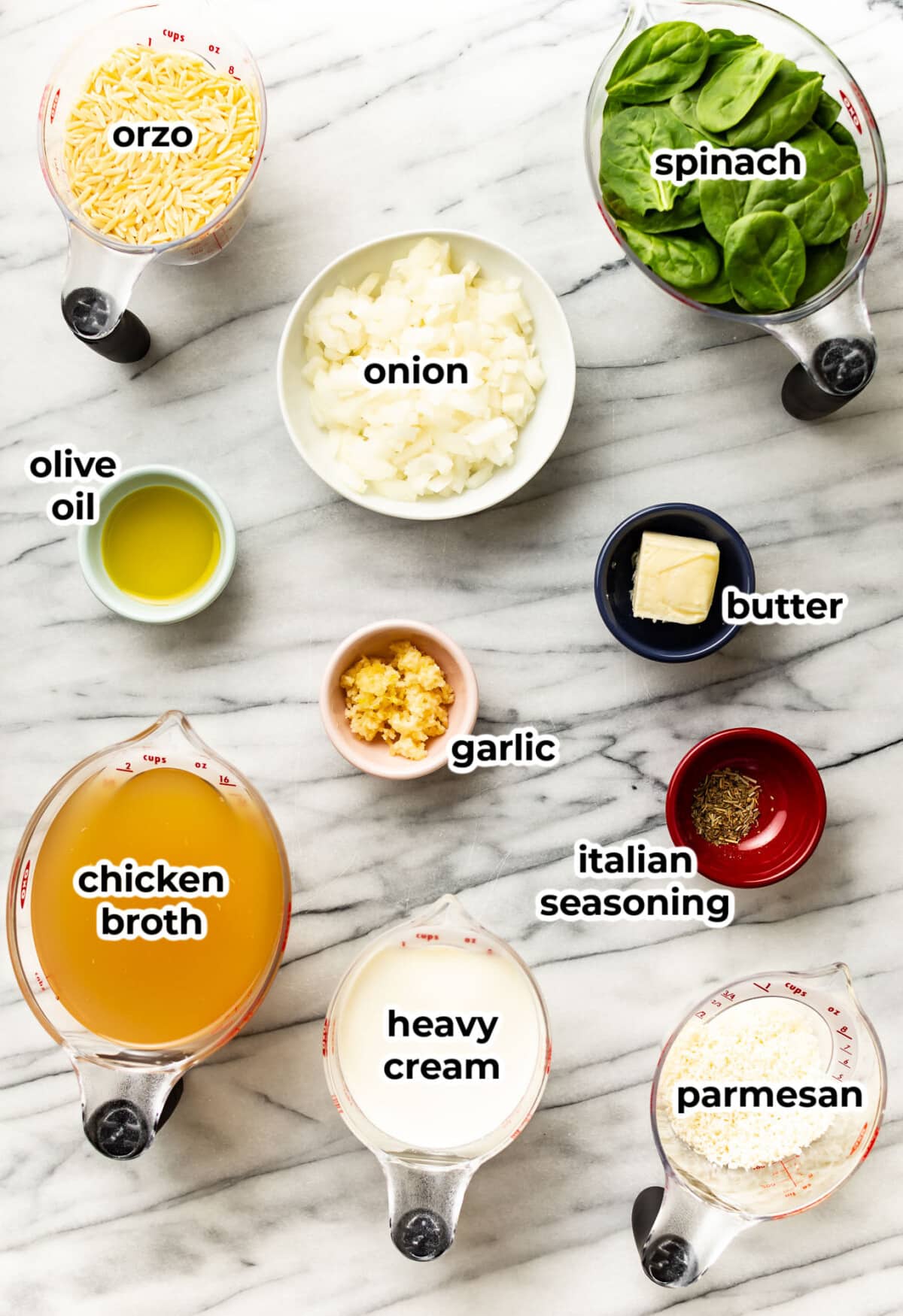 ingredients for creamy garlic spinach orzo in prep bowls