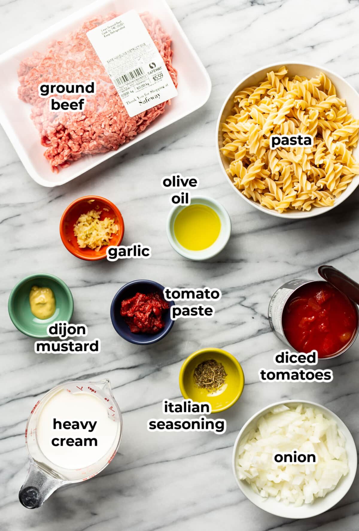 ingredients for ground beef pasta in prep bowls