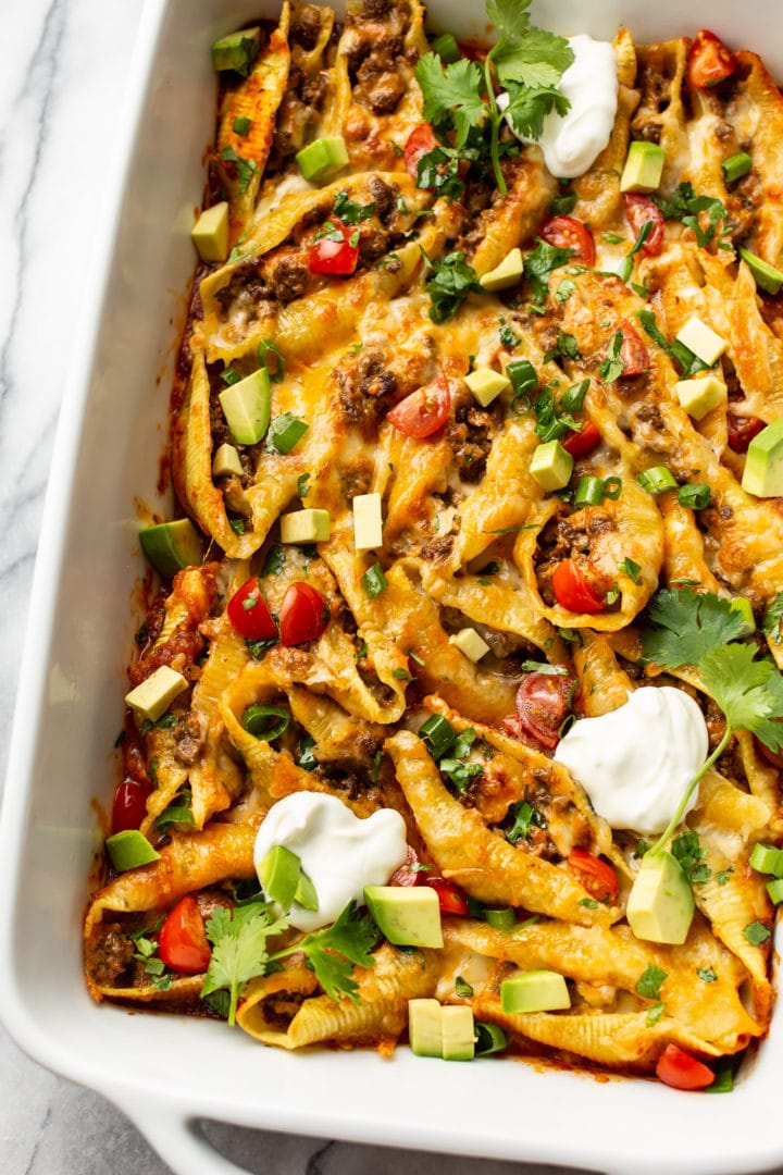 taco stuffed shells in a 9x13 baking dish