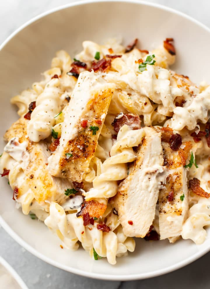 close-up of chicken bacon ranch pasta in a white bowl