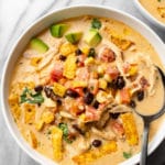 creamy chicken taco soup in two white bowls