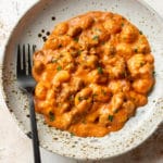 cheesy bratwurst sausage gnocchi in a shallow bowl