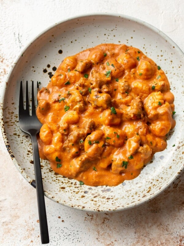 cheesy bratwurst sausage gnocchi in a shallow bowl