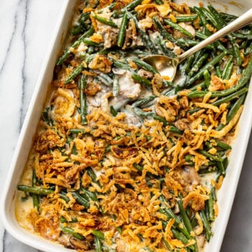 green bean casserole in a white 9x13 baking dish