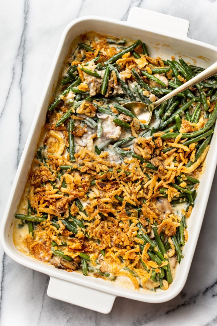 green bean casserole in a white 9x13 baking dish