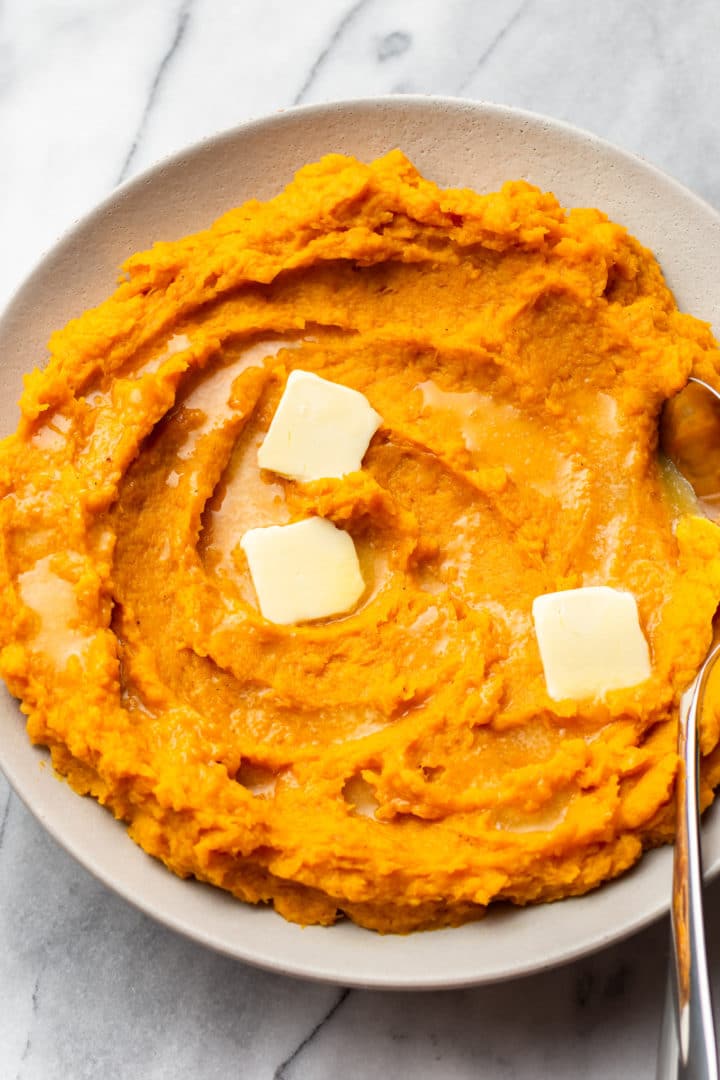 mashed butternut squash in a shallow serving bowl