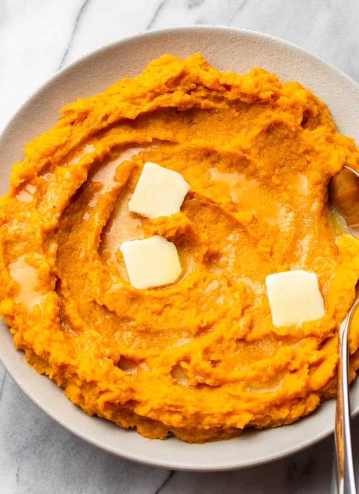 mashed butternut squash in a shallow serving bowl