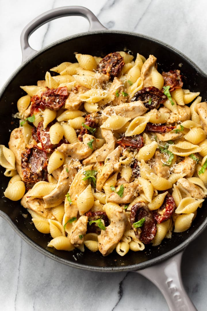 sun-dried tomato and chicken pasta in a skillet