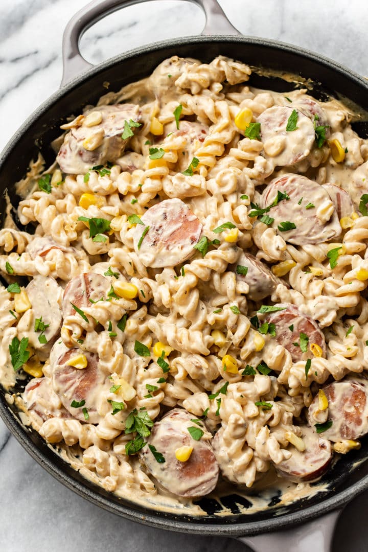 cream cheese smoked sausage pasta in a skillet