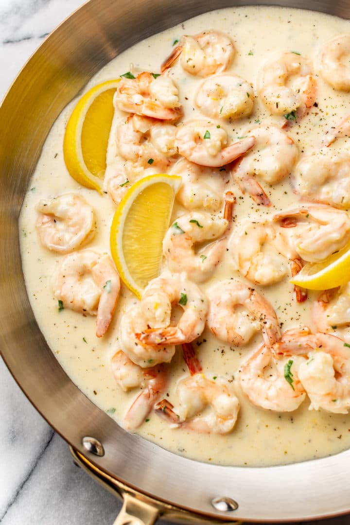 close-up of creamy lemon garlic shrimp in a skillet