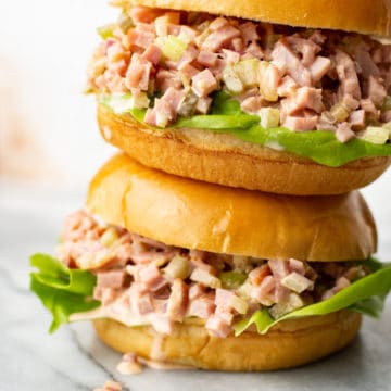 two ham salad sandwiches stacked on top of each other