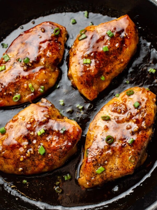 close-up of easy honey garlic chicken in a cast iron skillet