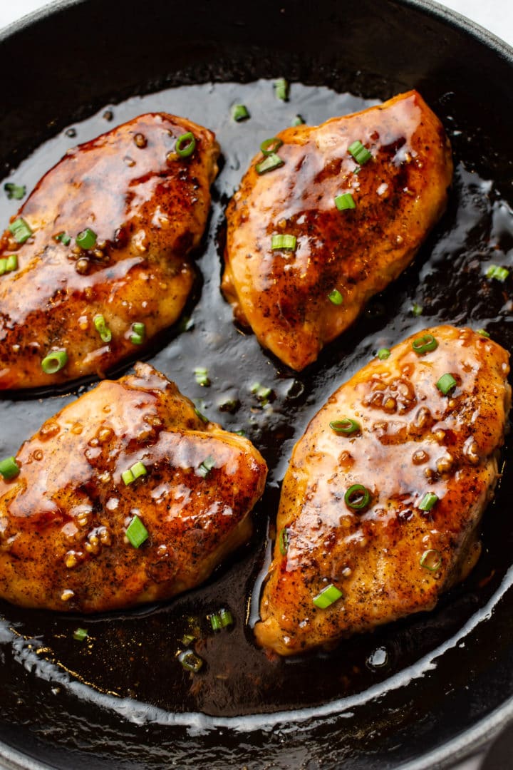 close-up of easy honey garlic chicken in a cast iron skillet