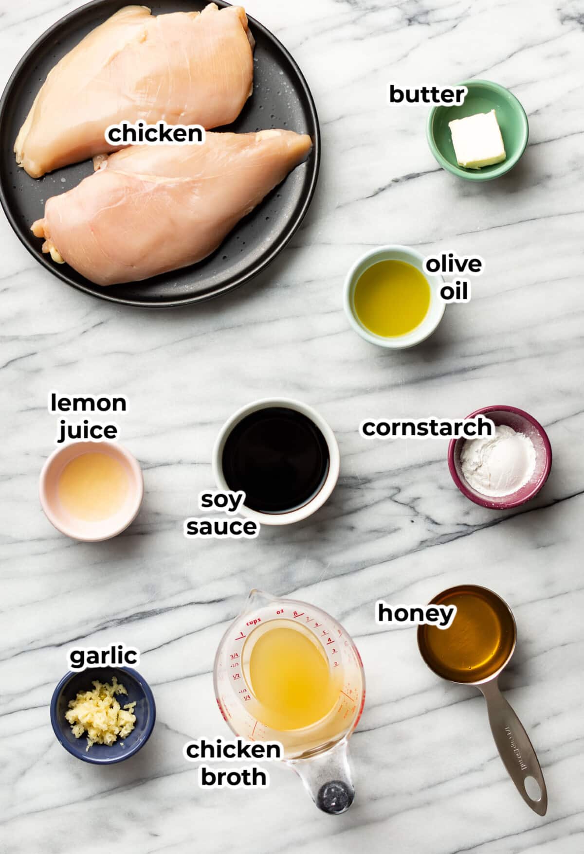 ingredients for honey garlic chicken in prep bowls