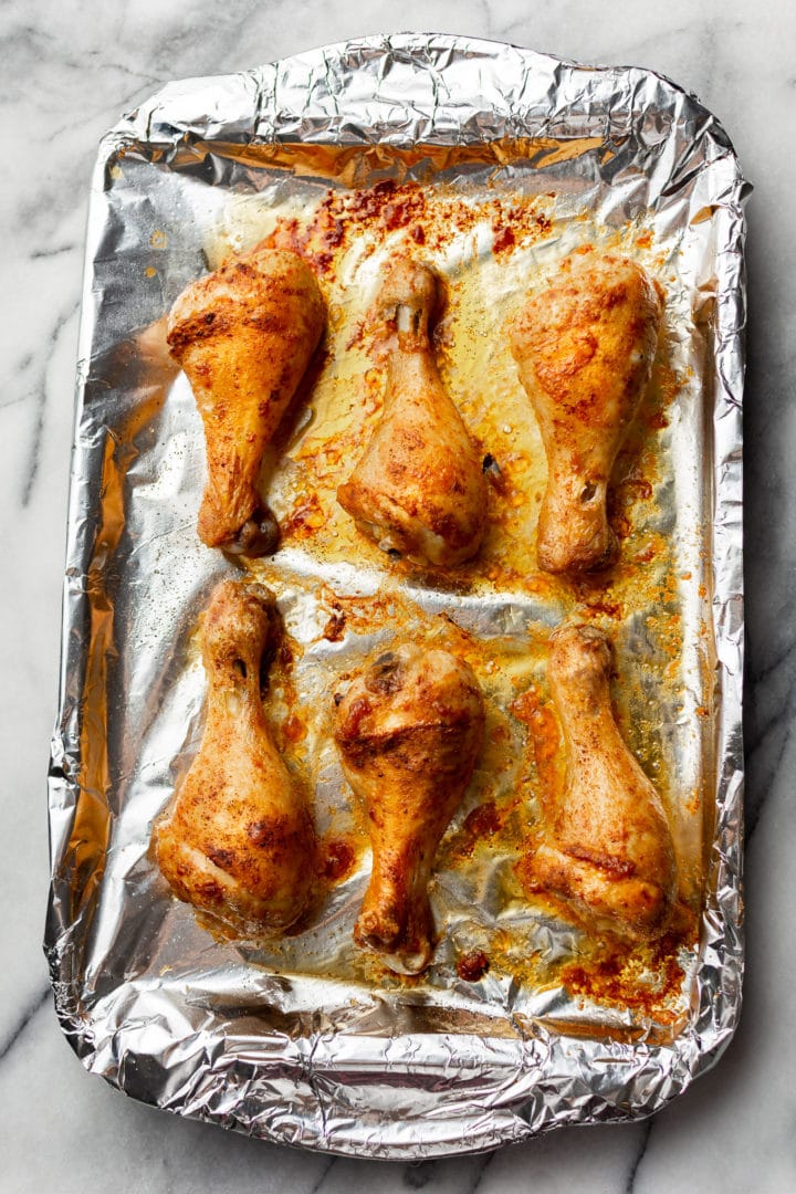 baked chicken legs straight out of the oven (on baking sheet)