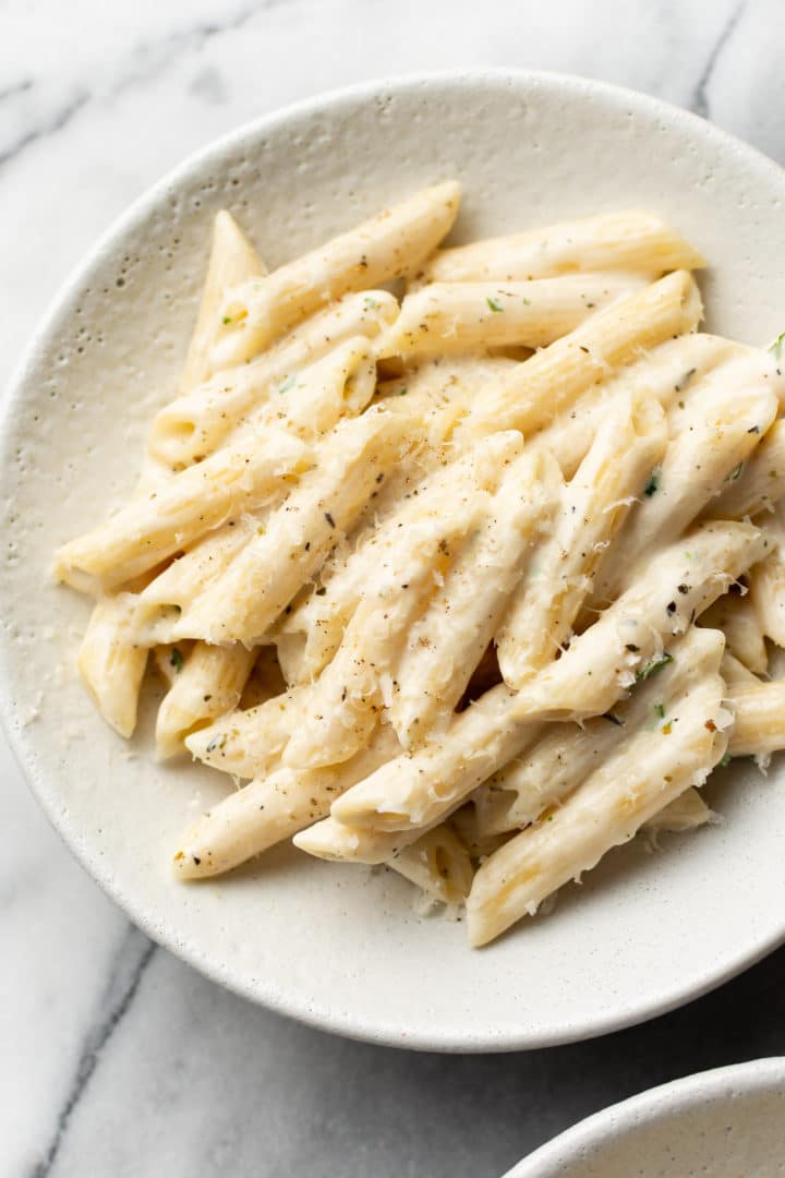 easy creamy penne pasta in a white bowl