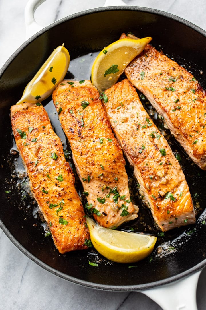 garlic butter salmon in a skillet