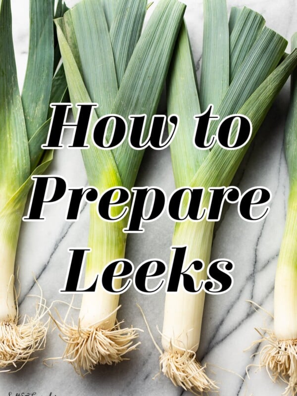 how to prepare leeks title graphic (text over a photo of four leeks)