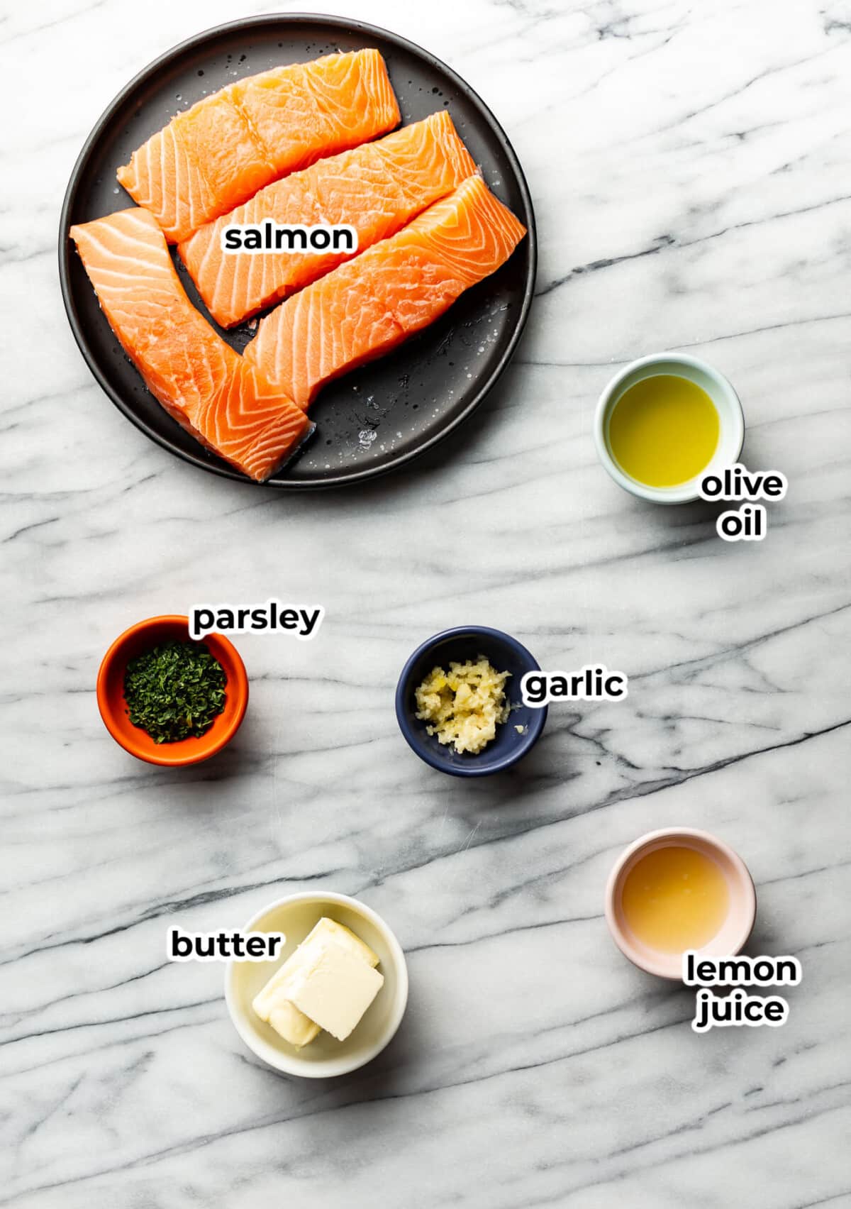 ingredients for garlic butter salmon in prep bowls