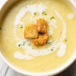 close-up of leek and potato soup in bowl topped with croutions