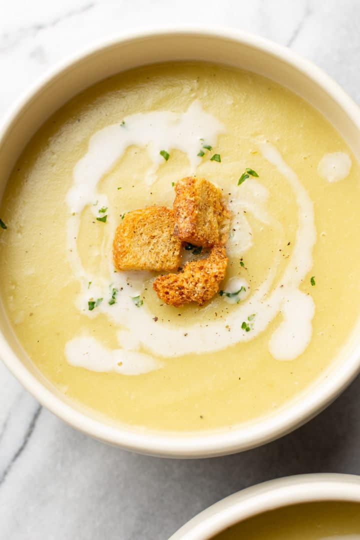 close-up of leek and potato soup in bowl topped with croutions