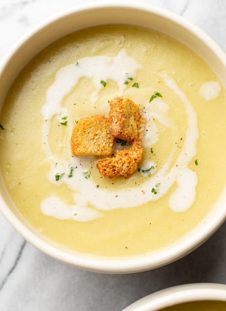 close-up of leek and potato soup in bowl topped with croutions