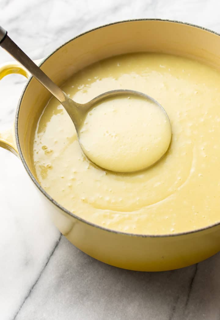 a pot full of potato leek soup (with ladle)