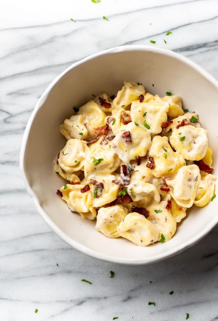 bacon ranch tortellini in a white bowl