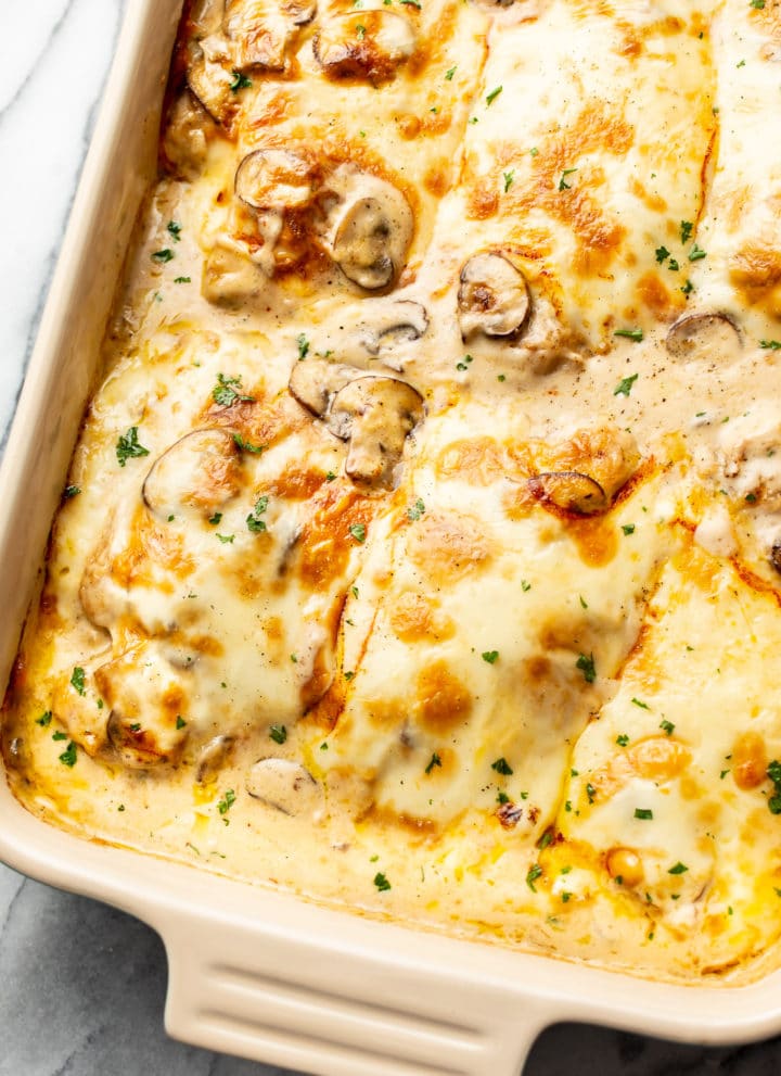 creamy, cheesy Chicken Gloria in a casserole dish close-up