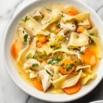 the best chicken noodle soup (in two bowls with one close-up)