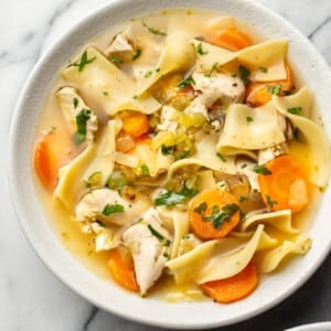 the best chicken noodle soup (in two bowls with one close-up)